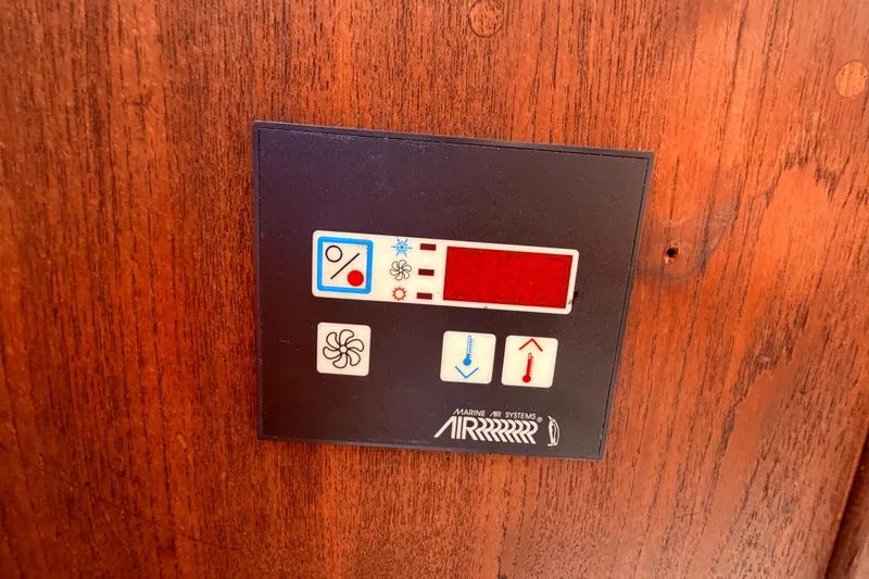 Slide: The Image of Control panel on a 1981 CAL 31 boat, featuring temperature and fan settings. - 28