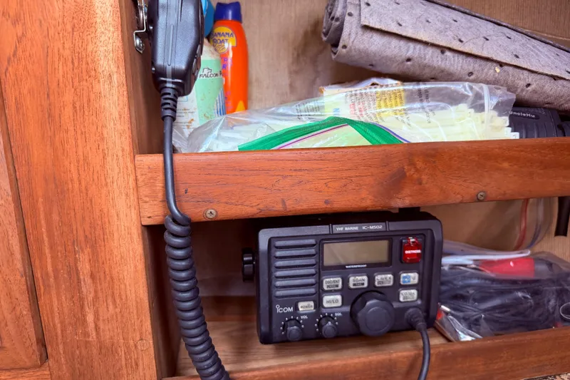 Slide: The Image of VHF marine radio in wooden cabinet with assorted supplies, CAL 31, 1981 model. - 46