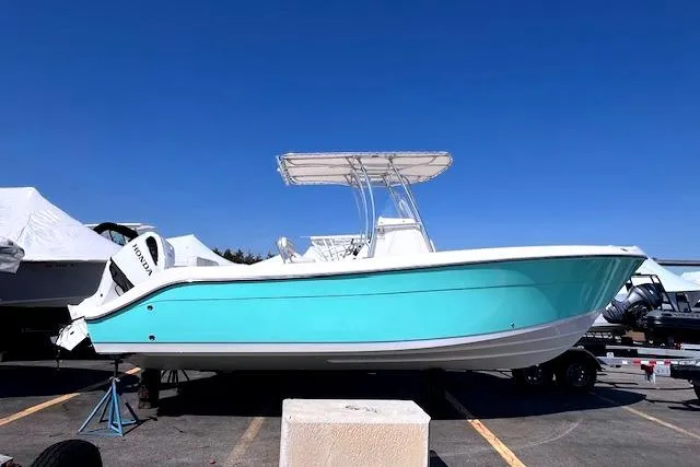 The Image of 2021 Cobia 237 Center Console boat on a trailer. - 0