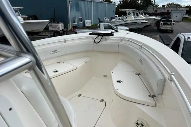 Slide: The Image of 2021 Cobia 237 Center Console boat interior with seating and storage compartments. - 10