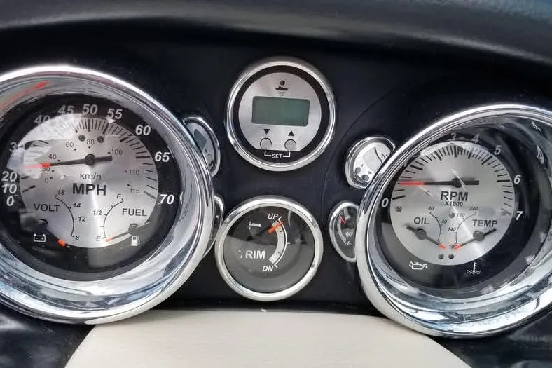 Slide: The Image of Dashboard of a 2016 Crownline 225 SS boat with speedometer and RPM gauges. - 6