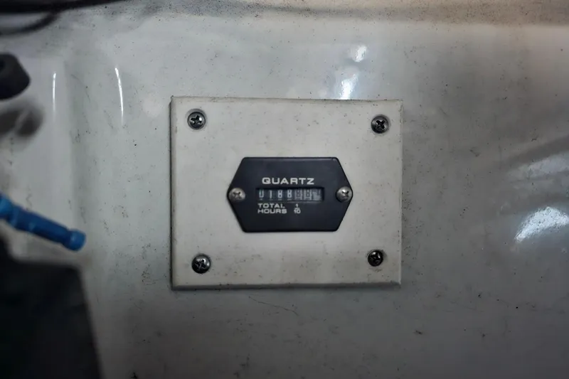 Slide: The Image of Hour meter on 2016 Crownline 225 SS boat, displaying total engine hours. - 9