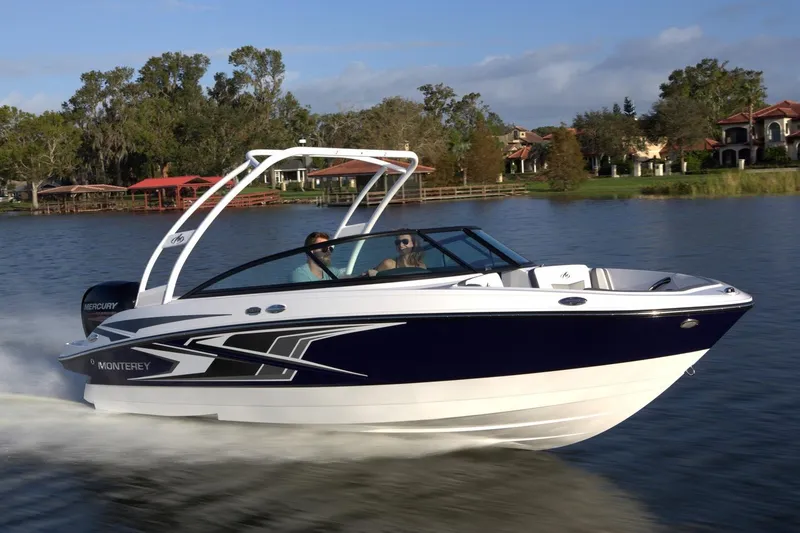 Slide: The Image of Manufacturer Provided Image: 2026 Monterey M-205 boat cruising on a lake with scenic background. - 2