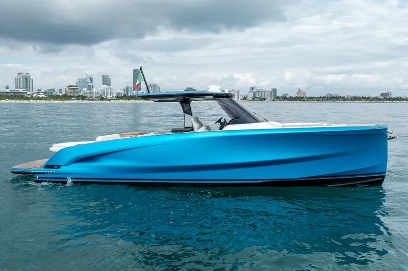 The Image of 2026 Solaris Power 44 Sport Turismo yacht on calm water with city skyline backdrop. - 0