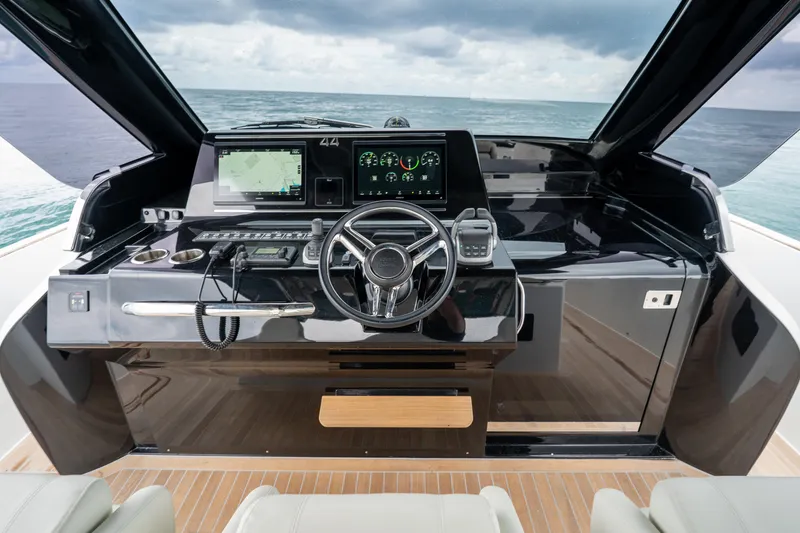Slide: The Image of Helm of 2026 Solaris Power 44 Sport Turismo yacht with modern navigation controls. - 11