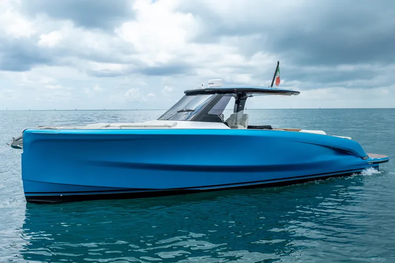 Slide: The Image of 2026 Solaris Power 44 Sport Turismo yacht on calm ocean under cloudy sky. - 2