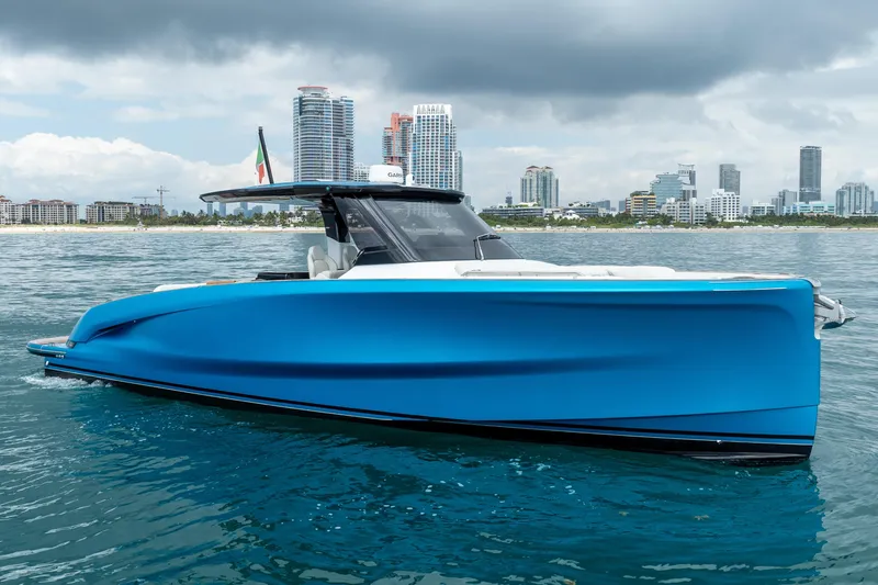Slide: The Image of 2026 Solaris Power 44 Sport Turismo yacht on water, city skyline in background. - 3