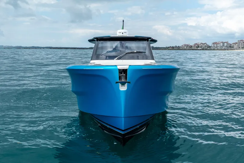 Slide: The Image of 2026 Solaris Power 44 Sport Turismo yacht on open water, showcasing sleek design and vibrant blue hull. - 4