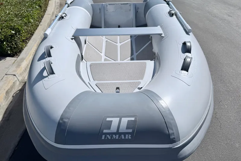 Slide: The Image of 2021 Inmar Aluma Lite 325R inflatable boat, gray, parked on pavement. - 4