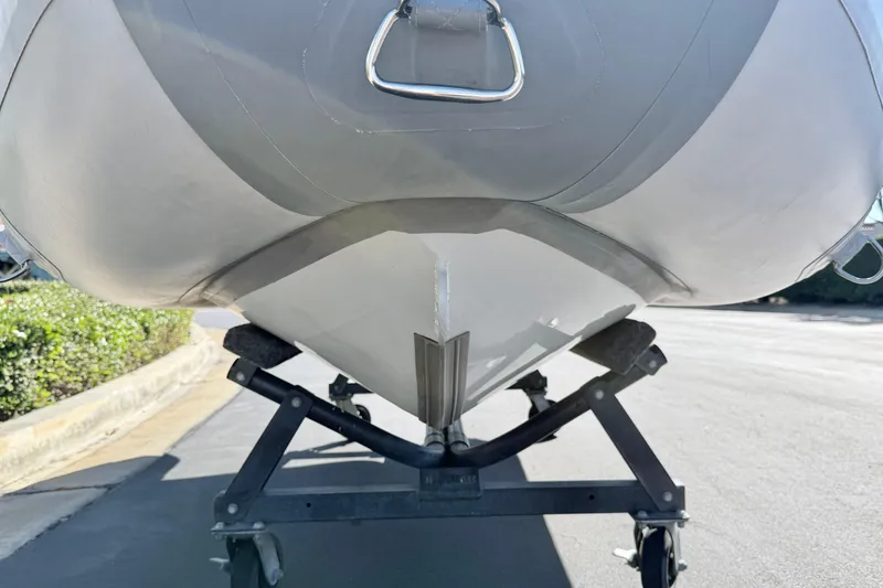 Slide: The Image of 2021 Inmar Aluma Lite 325R boat on trailer, close-up view of hull and keel. - 5
