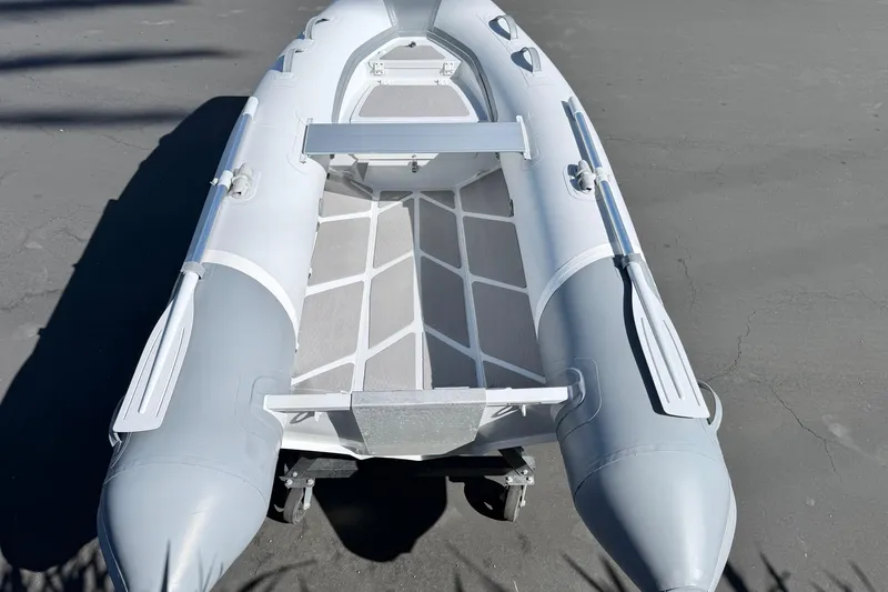 Slide: The Image of 2021 Inmar Aluma Lite 325R inflatable boat, top view, gray and white design. - 6