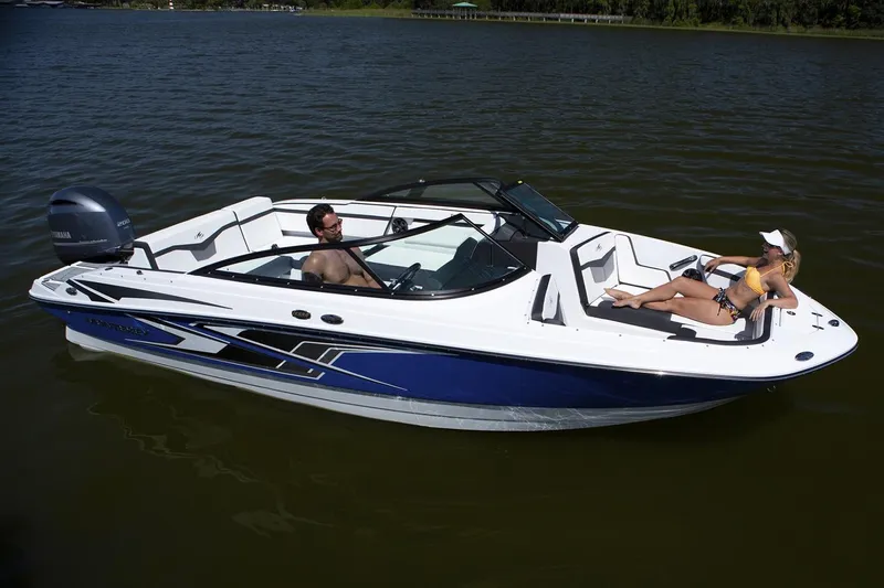 Slide: The Image of Manufacturer Provided Image: 2026 Monterey M-225 boat on water with two people relaxing onboard. - 2