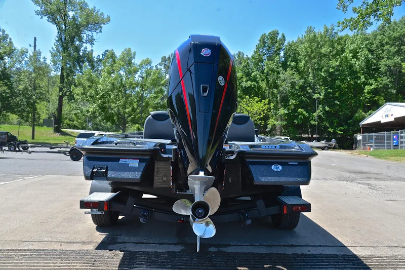 Slide: The Image of 2022 Caymas CX 20 boat rear view with powerful outboard motor. - 12