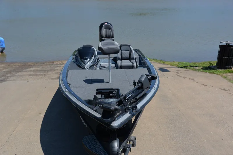 Slide: The Image of 2022 Caymas CX 20 boat on a concrete ramp by a calm lake. - 16