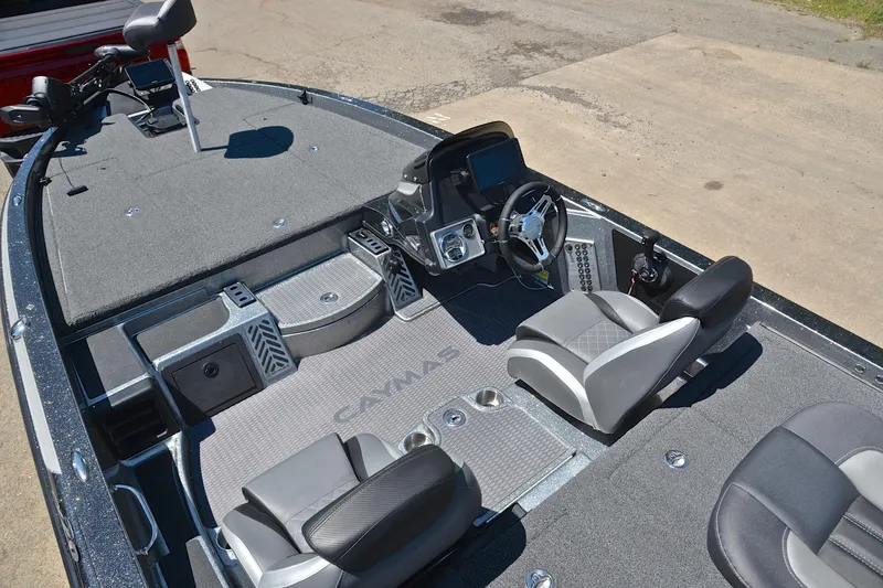 Slide: The Image of 2022 Caymas CX 20 boat interior with dual seats and modern dashboard. - 20