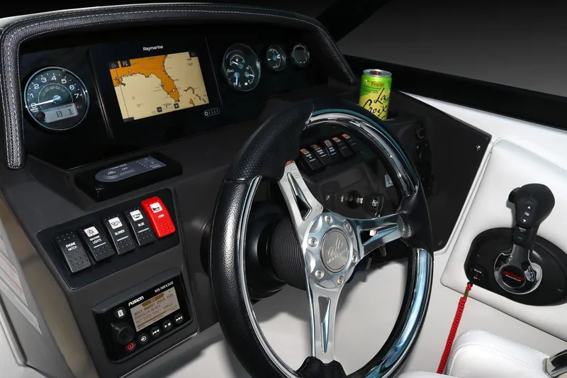 Slide: The Image of Manufacturer Provided Image: 2026 Monterey M-45 boat dashboard with steering wheel, navigation screen, and controls. - 2