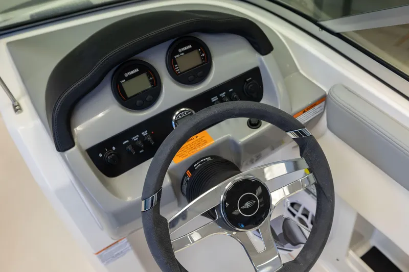 Slide: The Image of 2024 Chaparral 19 SSi OB dashboard with steering wheel and Yamaha gauges. - 10