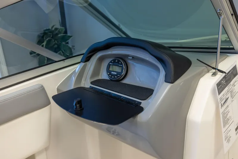Slide: The Image of 2024 Chaparral 19 SSi OB dashboard with Clarion audio system and sleek design. - 12