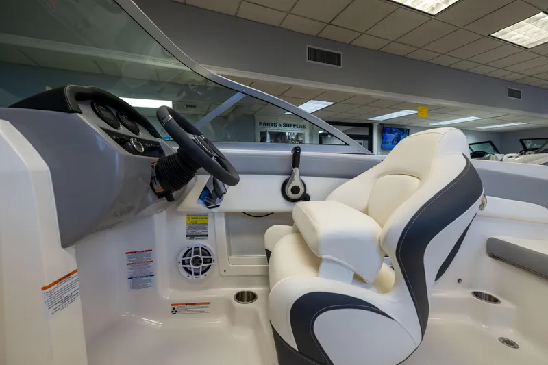 Slide: The Image of 2024 Chaparral 19 SSi OB boat interior with steering wheel and comfortable seating. - 15