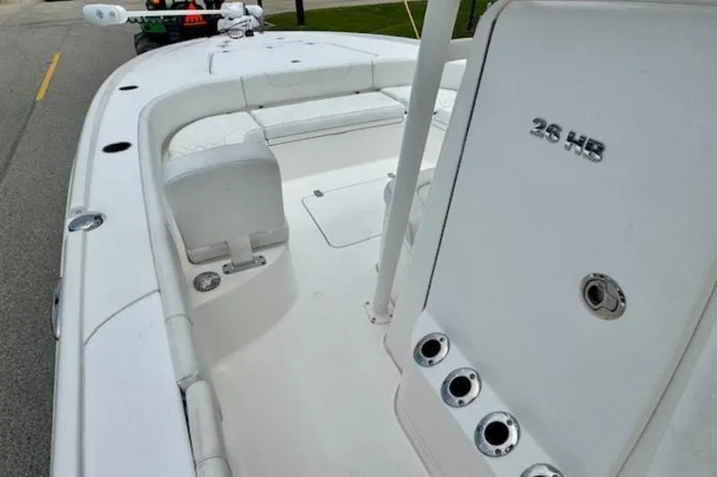 Slide: The Image of 2023 Caymas 26 HB boat deck with seating and storage compartments. - 13