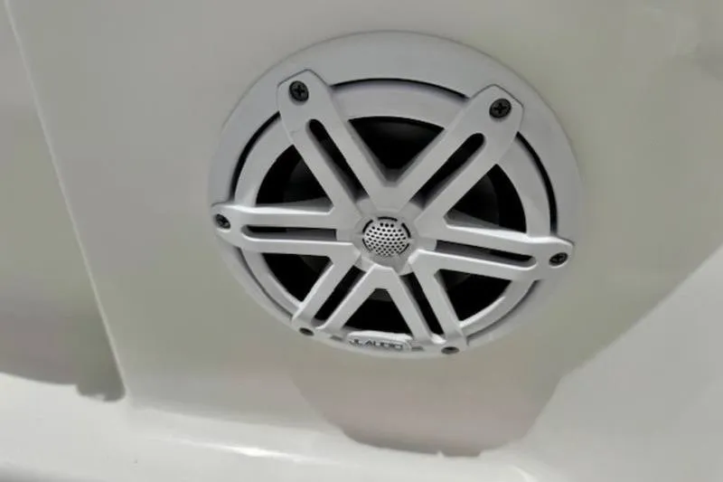 Slide: The Image of 2023 Caymas 26 HB boat speaker with sleek white grille design. - 21