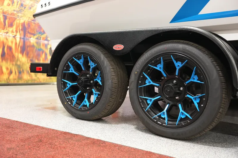 Slide: The Image of Trailer with stylish blue and black wheels, iKon VLE21, 2026 model. - 1