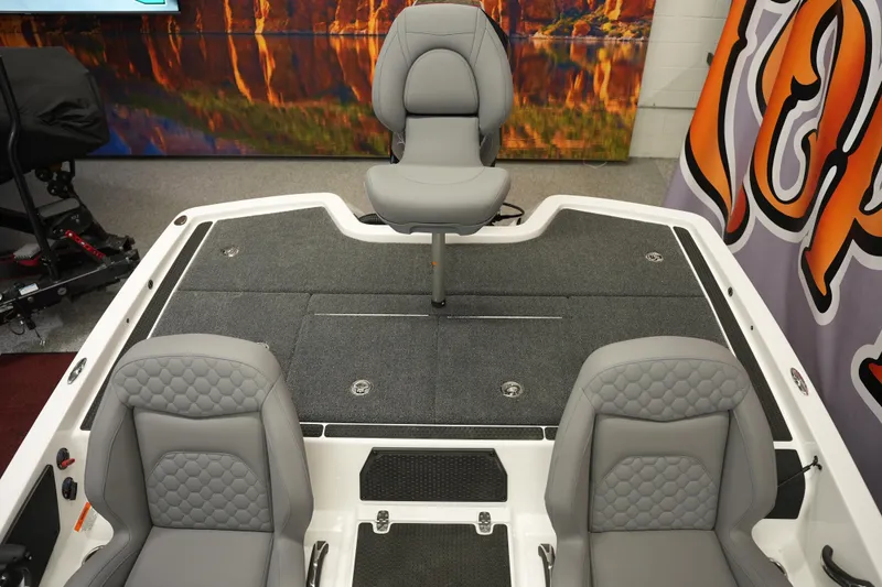 Slide: The Image of 2026 iKon VLE21 boat interior with gray seating and carpeted deck. - 11