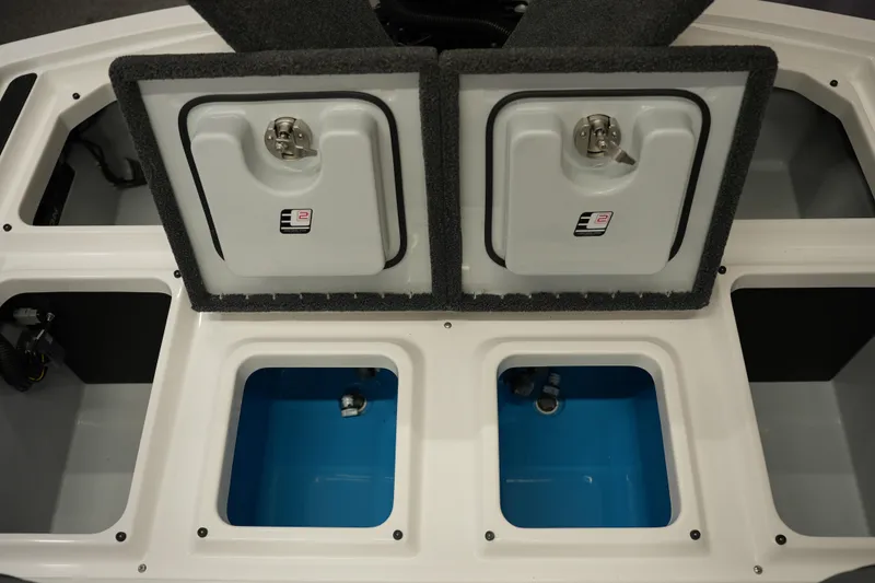 Slide: The Image of 2026 iKon VLE21 boat storage compartments with open lids and blue interior. - 13