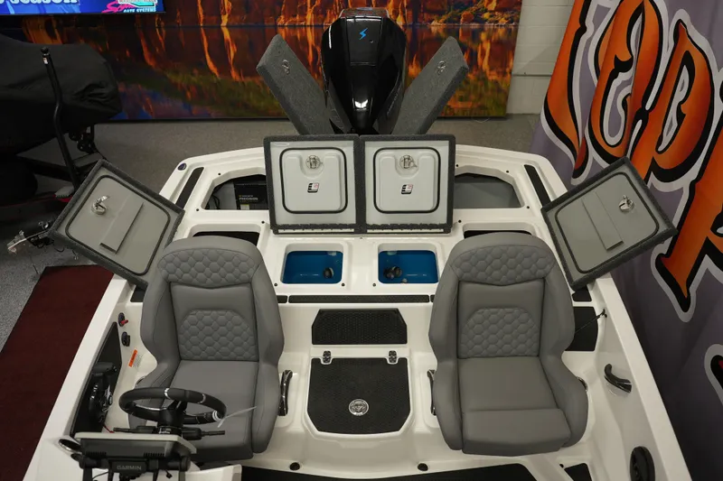 Slide: The Image of 2026 iKon VLE21 boat interior with open storage compartments and two gray seats. - 14