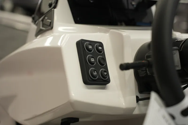 Slide: The Image of Control panel of 2026 iKon VLE21 boat, featuring multiple buttons and steering wheel. - 16