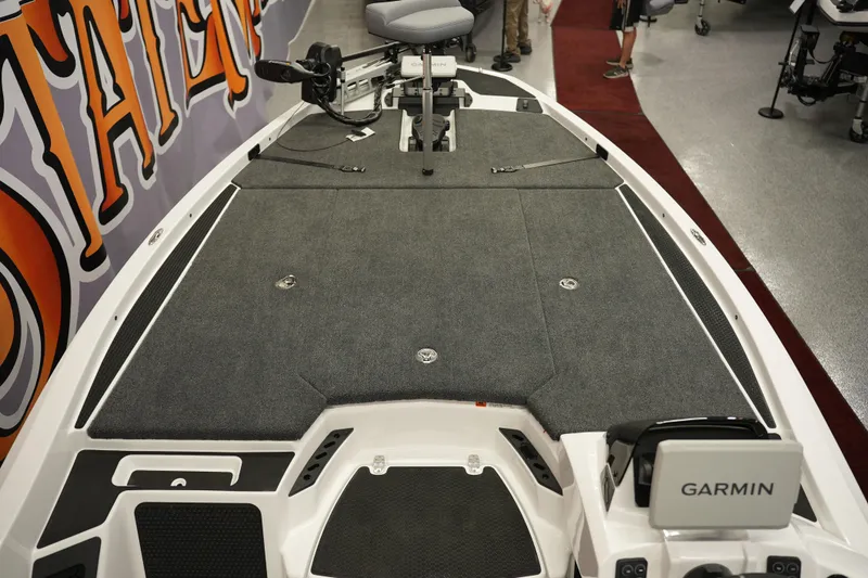 Slide: The Image of iKon VLE21 2026 boat interior with Garmin system, featuring spacious deck and seating. - 18