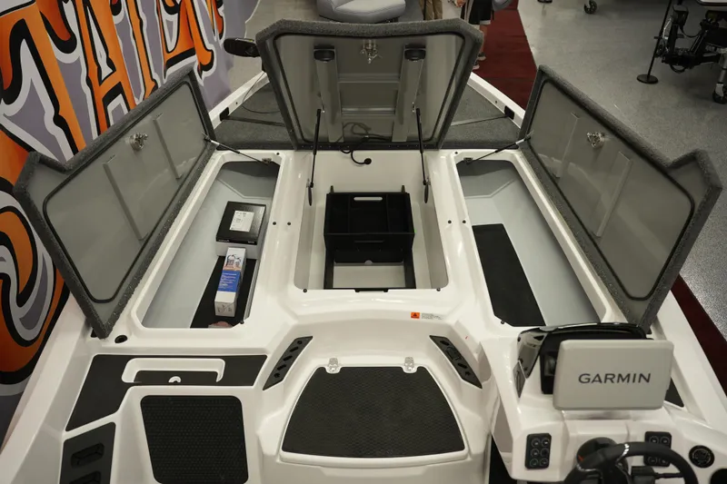 Slide: The Image of Open storage compartments on a 2026 iKon VLE21 boat with Garmin equipment. - 19