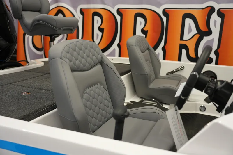 Slide: The Image of Gray seats in a 2026 iKon VLE21 boat interior with vibrant backdrop. - 5