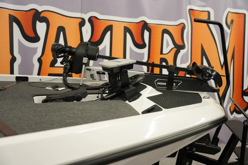 Slide: The Image of 2026 iKon VLE21 boat with Minn Kota trolling motor, showcased indoors. - 6