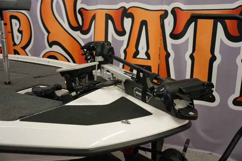 Slide: The Image of 2026 iKon VLE21 boat with Minn Kota trolling motor and Garmin electronics, showcased indoors. - 9