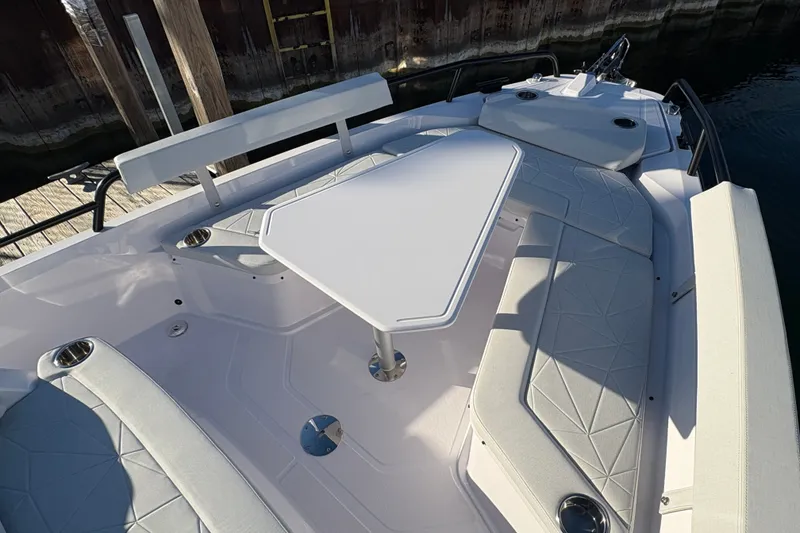 Slide: The Image of 2026 Axopar 29 XC Cross Cabin boat interior with seating and table. - 9