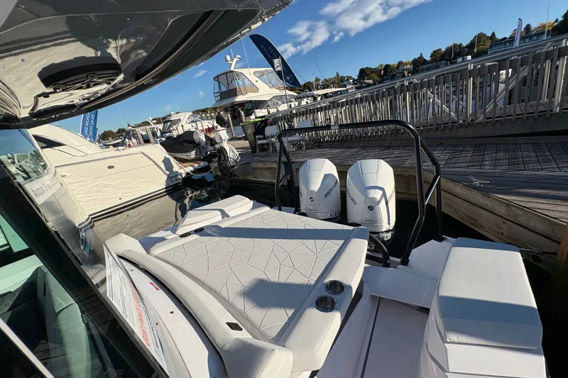 Slide: The Image of 2026 Axopar 29 XC Cross Cabin docked, featuring dual Mercury outboard engines. - 22