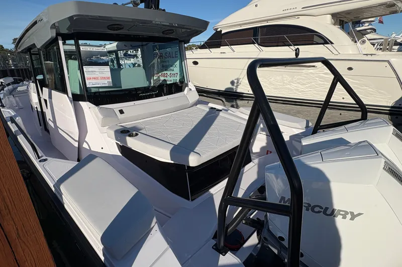 Slide: The Image of 2026 Axopar 29 XC Cross Cabin boat for sale, docked with Mercury engines. - 3