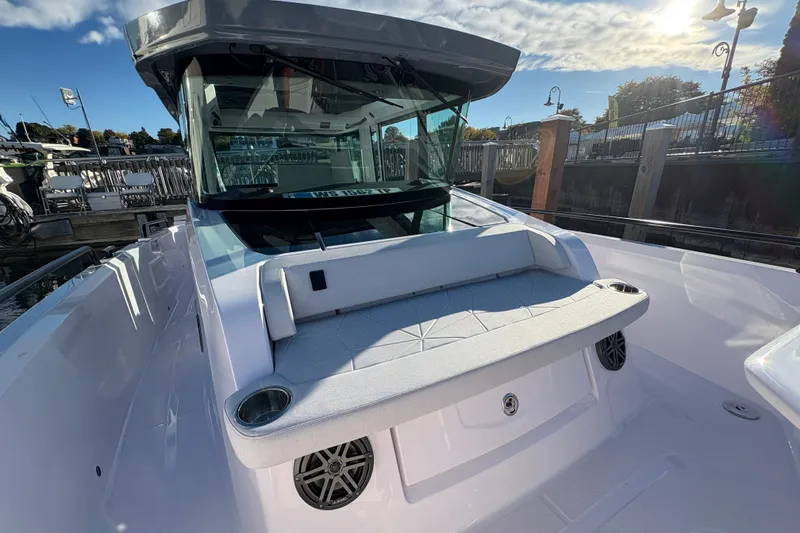Slide: The Image of 2026 Axopar 29 XC Cross Cabin boat docked under a sunny sky. - 10
