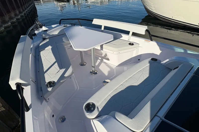 Slide: The Image of 2026 Axopar 29 XC Cross Cabin boat interior with seating and table. - 8