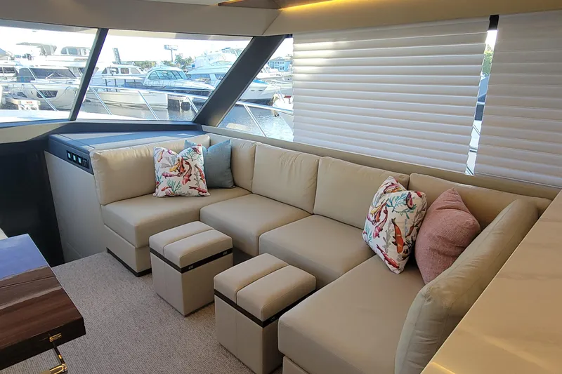 Slide: The Image of Luxurious interior of 2025 Maritimo M55 yacht with plush seating and cushions. - 14