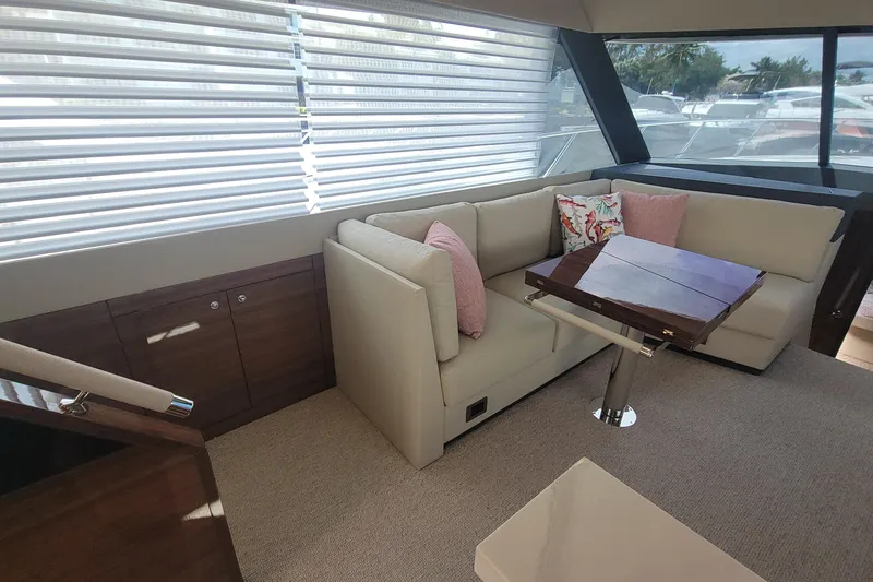 Slide: The Image of Luxurious interior of 2025 Maritimo M55 yacht with elegant seating and decorative pillows. - 18