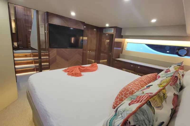 Slide: The Image of Luxurious bedroom interior of 2025 Maritimo M55 yacht with elegant bedding and ambient lighting. - 23