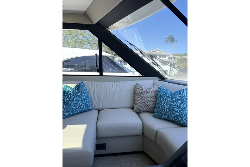 Slide: The Image of Luxurious interior of 2025 Maritimo M55 yacht with plush seating and decorative pillows. - 32