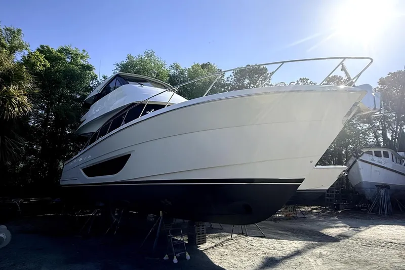 Slide: The Image of Maritimo M55 2025 yacht propped up outdoors. - 43