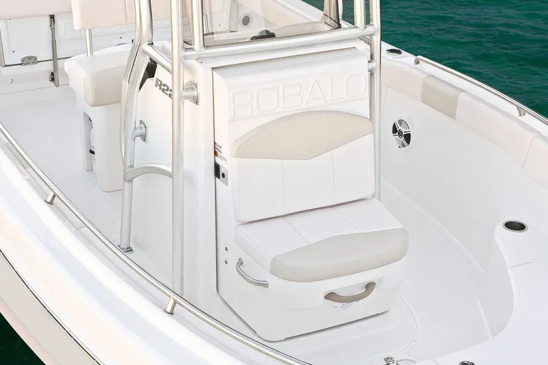 Slide: The Image of Manufacturer Provided Image: 2018 Robalo R222 Center Console boat interior with white seating and storage. - 5