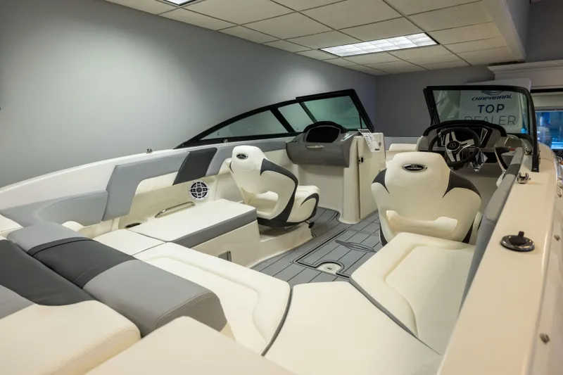 Slide: The Image of 2026 Chaparral 23 SSi boat interior with modern seating and steering wheel. - 14