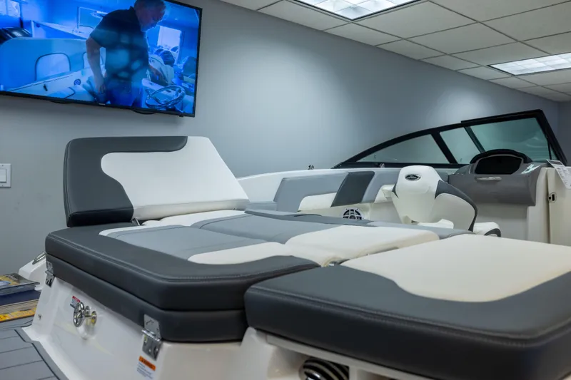 Slide: The Image of 2026 Chaparral 23 SSi boat interior with modern seating and dashboard display. - 19
