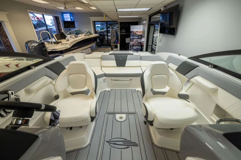 Slide: The Image of Interior view of 2026 Chaparral 23 SSi boat with luxurious seating and modern design. - 25