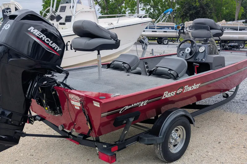 Slide: The Image of 2021 Tracker Bass Tracker Classic XL boat with Mercury engine on trailer. - 2